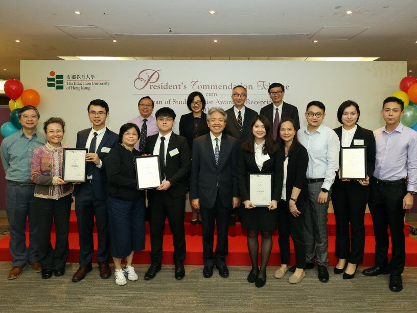 Officiating guests pose a photo with awardees of The Whole Person Development Award and their families.